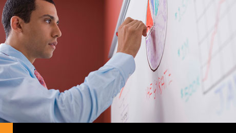 picture of man writing on board